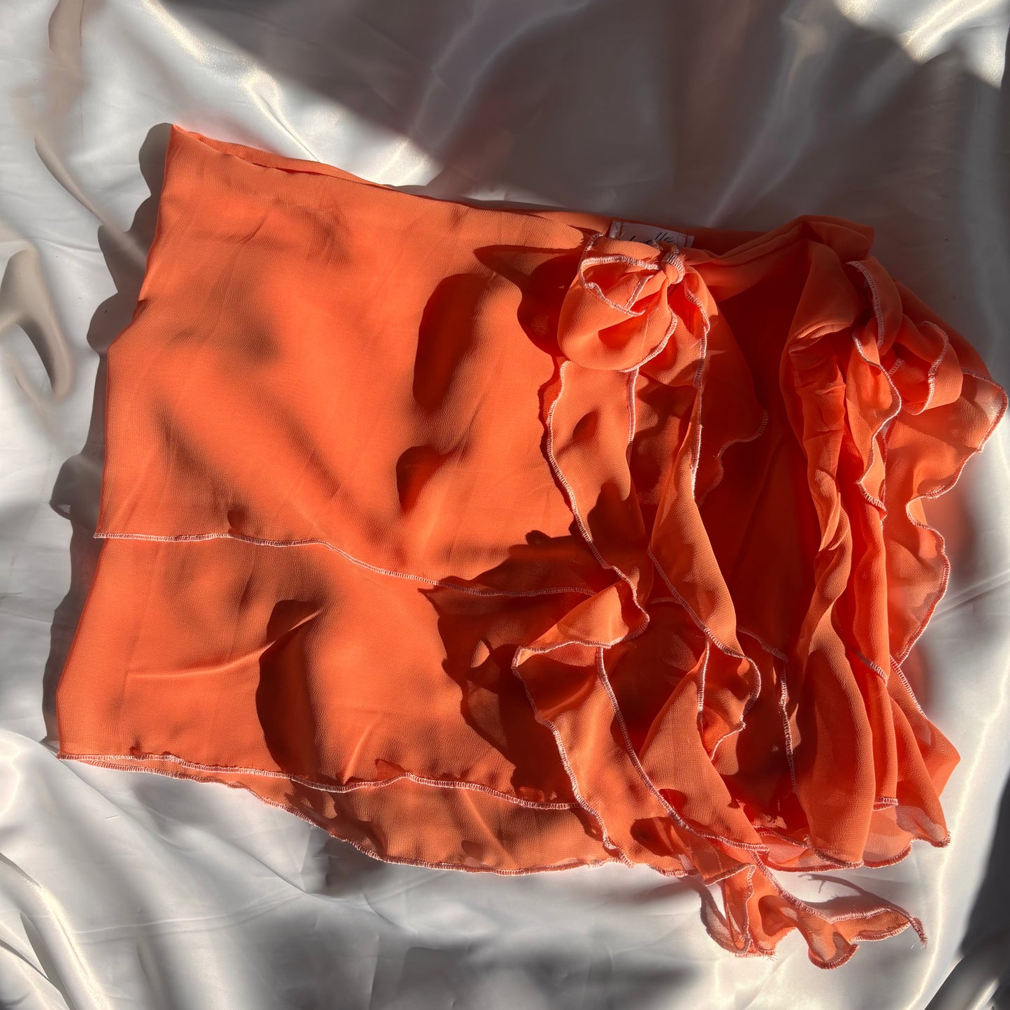 Orange tied ruffle skirt