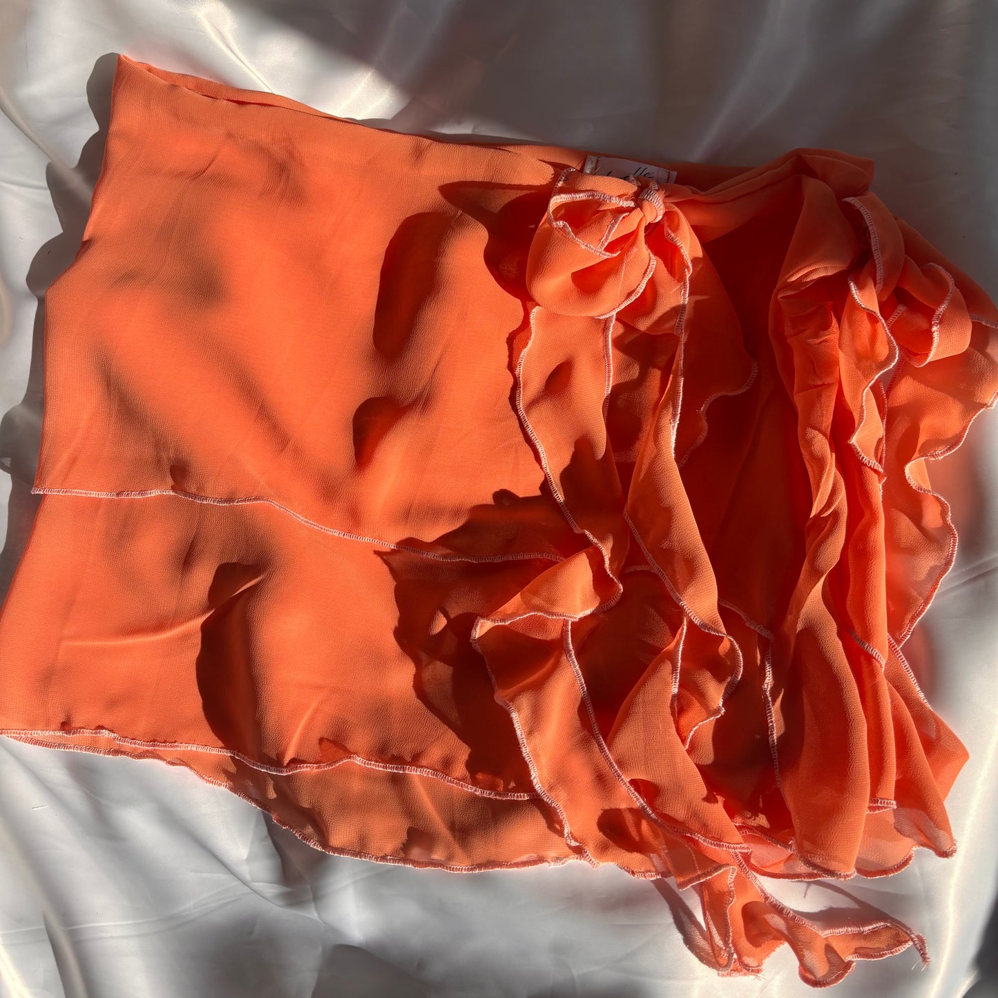 Orange tied ruffle skirt